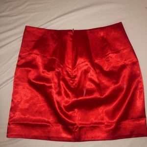 red silky skirt